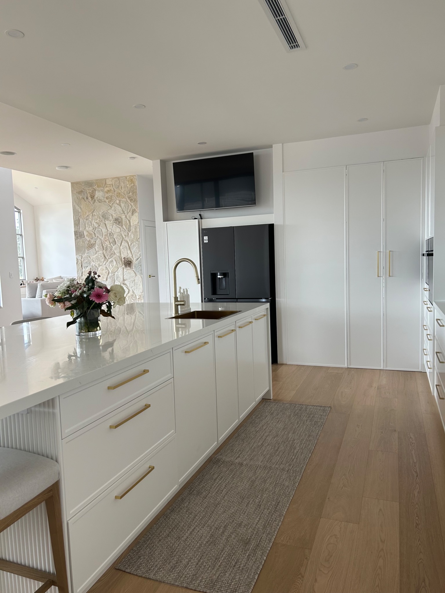 Integrated kitchen and storage joinery completed by Autograph Kitchens and Bathrooms